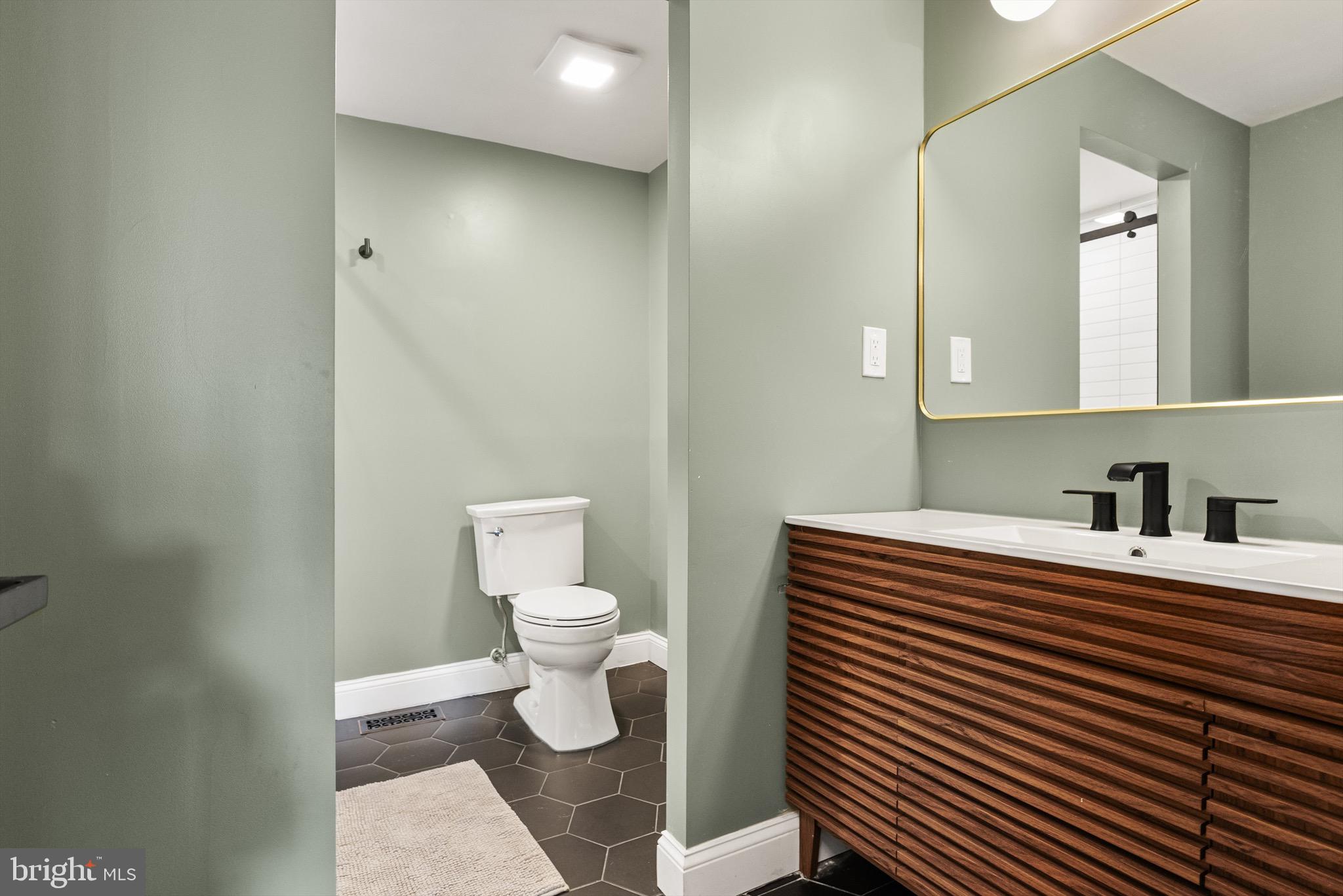 169 Canterbury Road Mount Laurel, NJ 08054 - Photo 29 of 47 a bathroom with a sink a toilet and a mirror