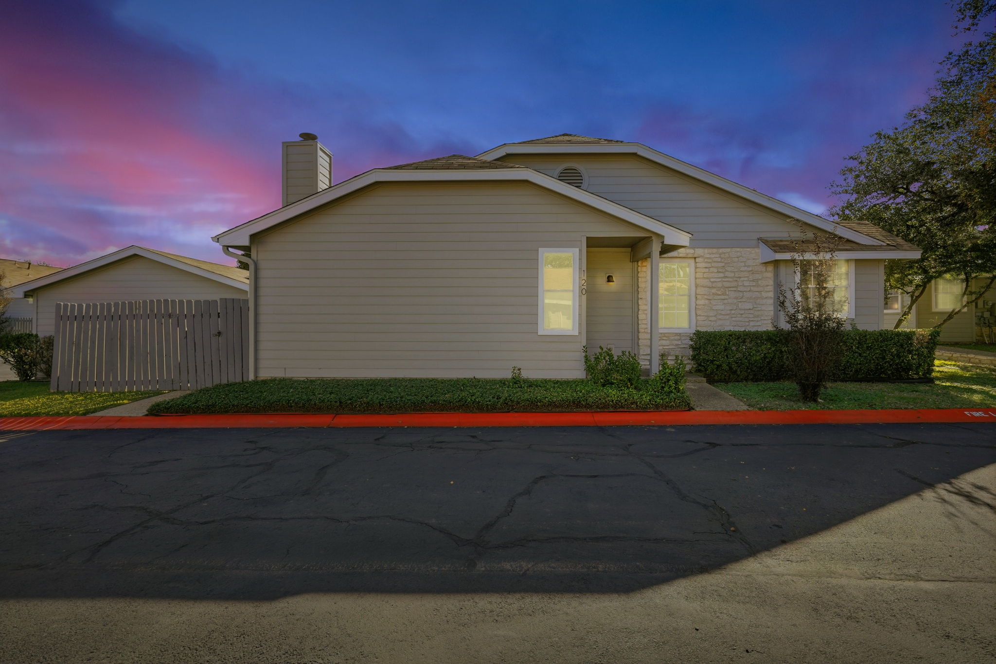 a front view of a house with yard