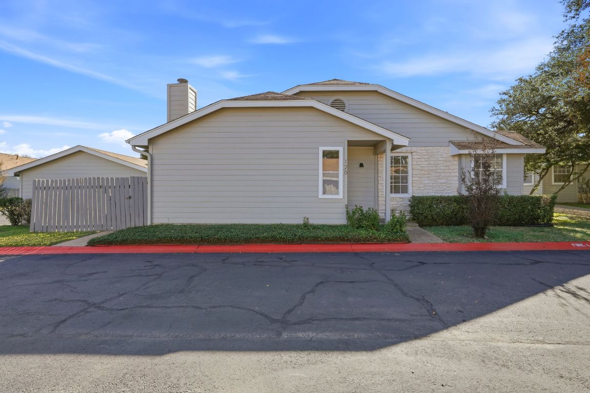 6501 Brush Country Road, Unit 120 Austin, TX 78749 - Photo 2 of 35 View of front of home featuring a chimney and stone siding