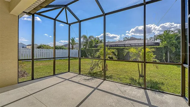 an aerial view of a house with yard swimming pool and outdoor seating