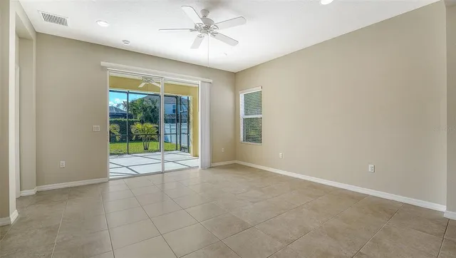 a view of an empty room with a window