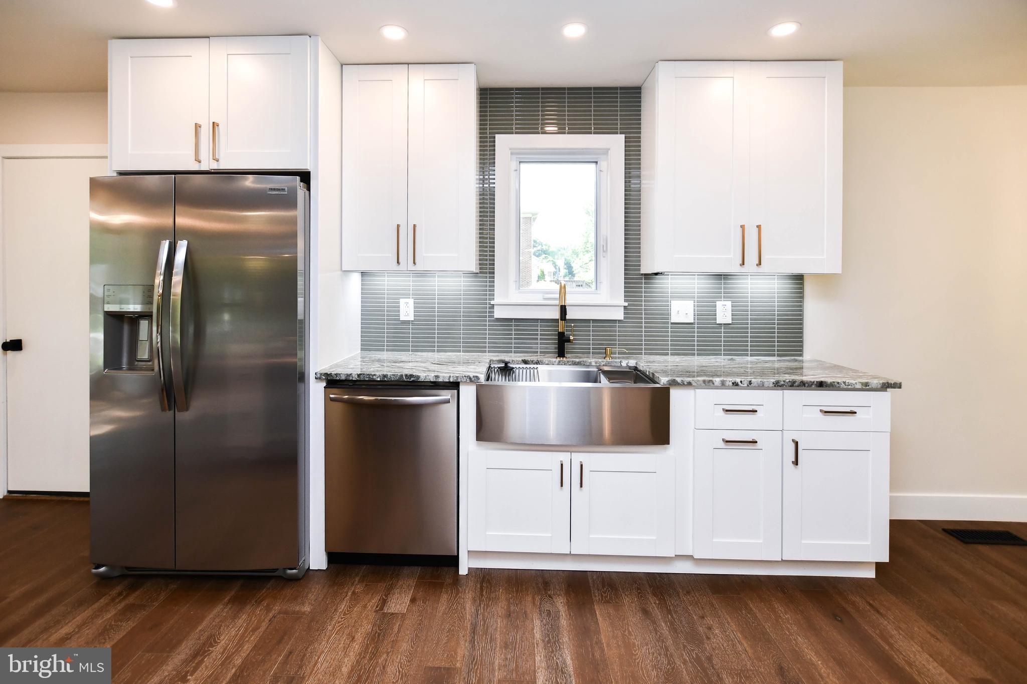 1423 Albert Drive Bowie, MD 20721 - Photo 28 of 86 a kitchen with stainless steel appliances granite countertop a refrigerator a sink and a stove