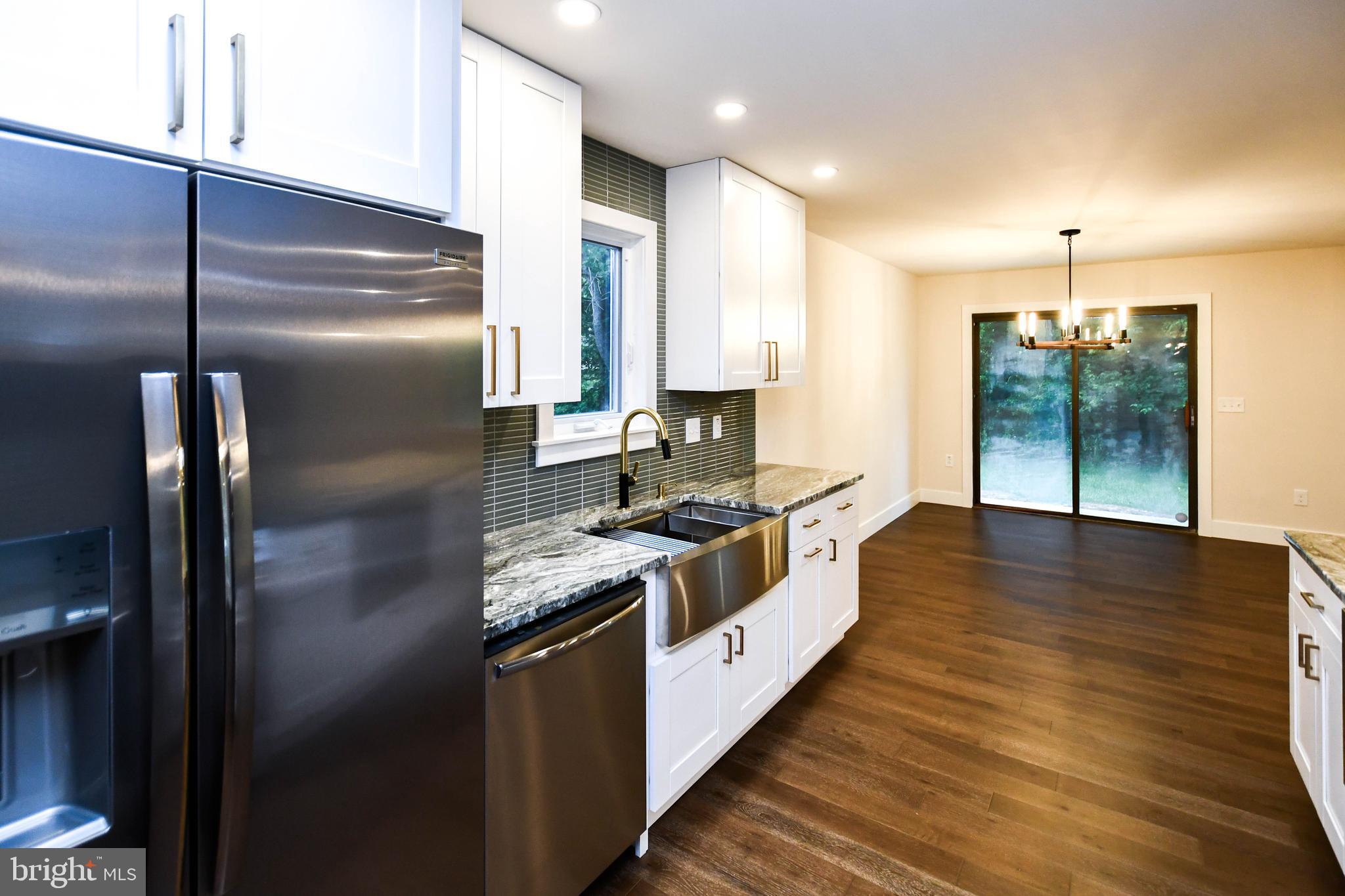 1423 Albert Drive Bowie, MD 20721 - Photo 37 of 86 a kitchen with stainless steel appliances granite countertop a stove a refrigerator and a sink