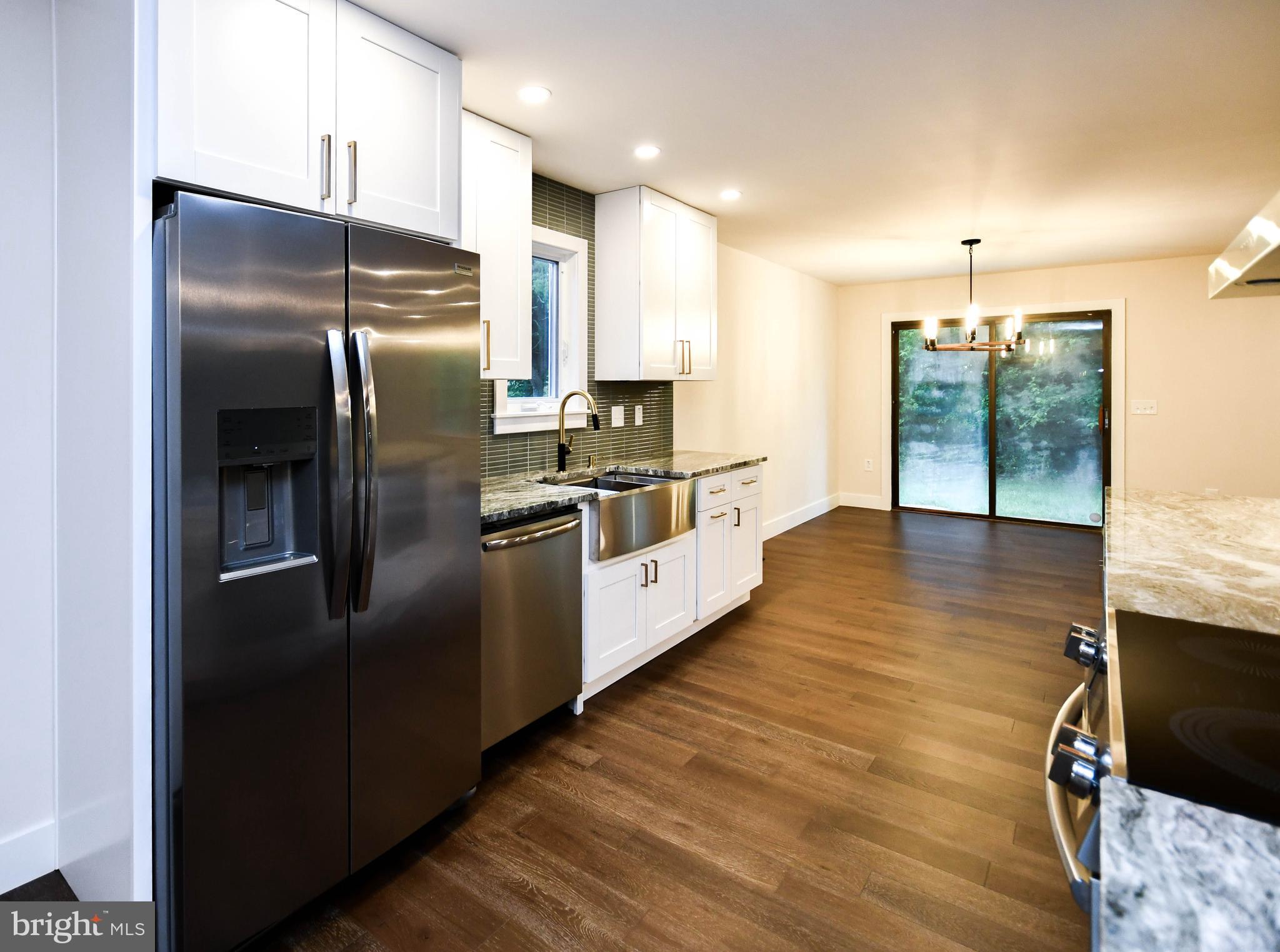 1423 Albert Drive Bowie, MD 20721 - Photo 38 of 86 a kitchen with stainless steel appliances granite countertop a refrigerator a sink a stove and oven