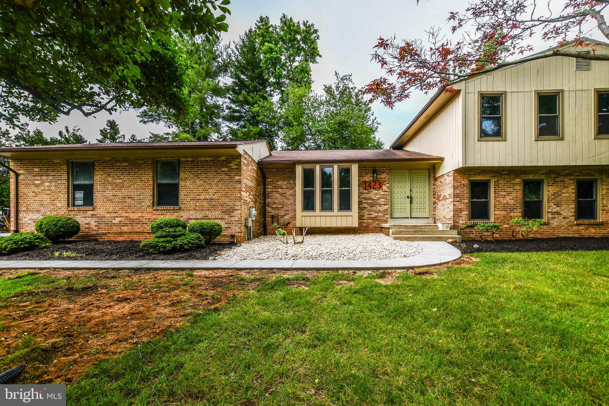 1423 Albert Drive Bowie, MD 20721 - Photo 5 of 86 a front view of a house with a yard