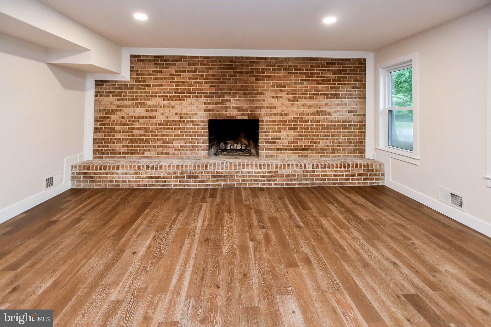 1423 Albert Drive Bowie, MD 20721 - Photo 69 of 86 a view of wooden floor with brick walls