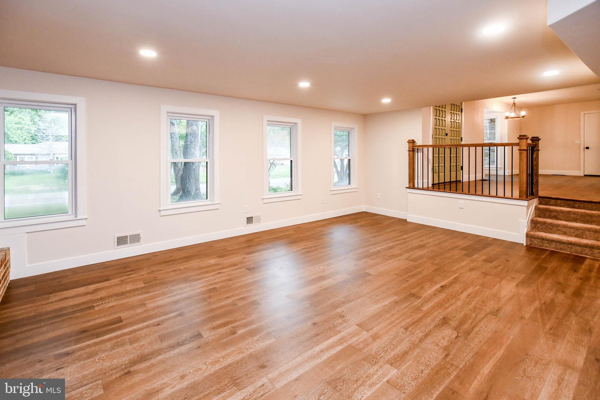 1423 Albert Drive Bowie, MD 20721 - Photo 70 of 86 a view of an empty room with wooden floor and a window