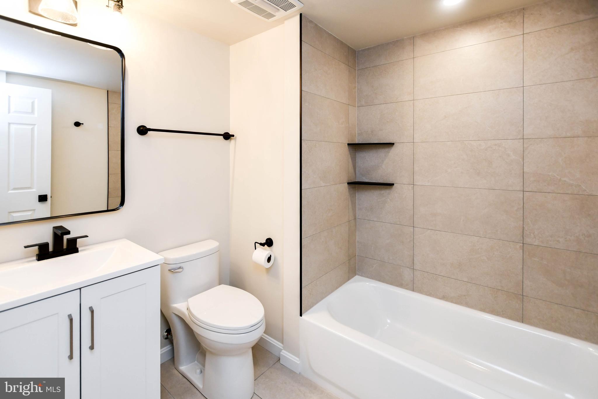 1423 Albert Drive Bowie, MD 20721 - Photo 77 of 86 a bathroom with a toilet sink and shower