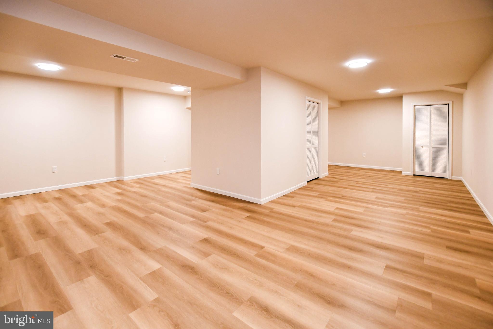 1423 Albert Drive Bowie, MD 20721 - Photo 84 of 86 a view of an empty room with wooden floor