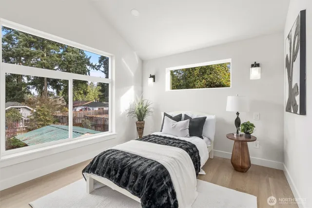 a bedroom with a bed and a sink