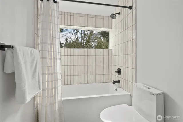 a room with a sink and a mirror