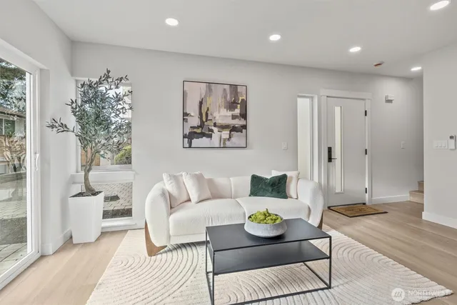 a living room with furniture and a table
