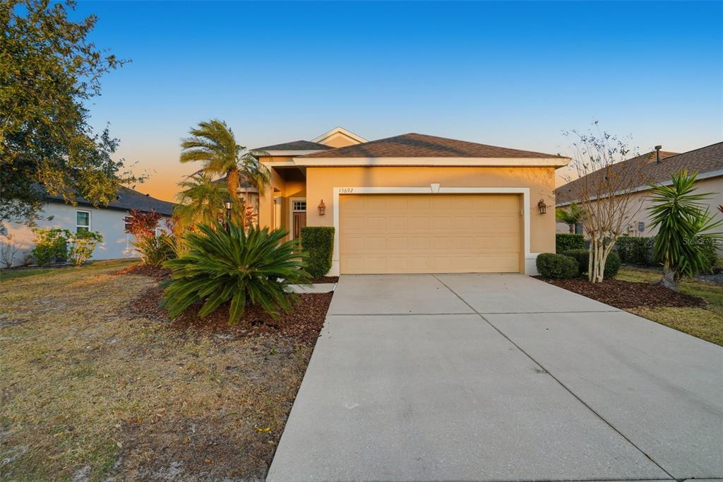 15692 Lemon Fish Drive Lakewood Ranch, FL 34202 - Photo 1 of 1 a front view of a house with a yard and garage