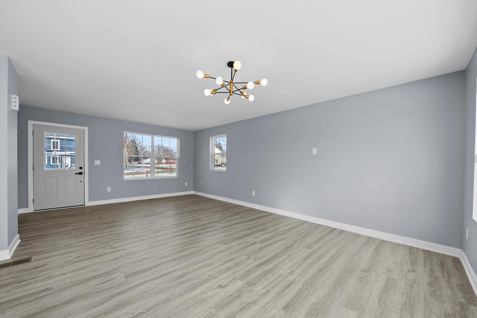 106 West Thompson Street Harvard, IL 60033 - Photo 15 of 46 wooden floor in an empty room with a window