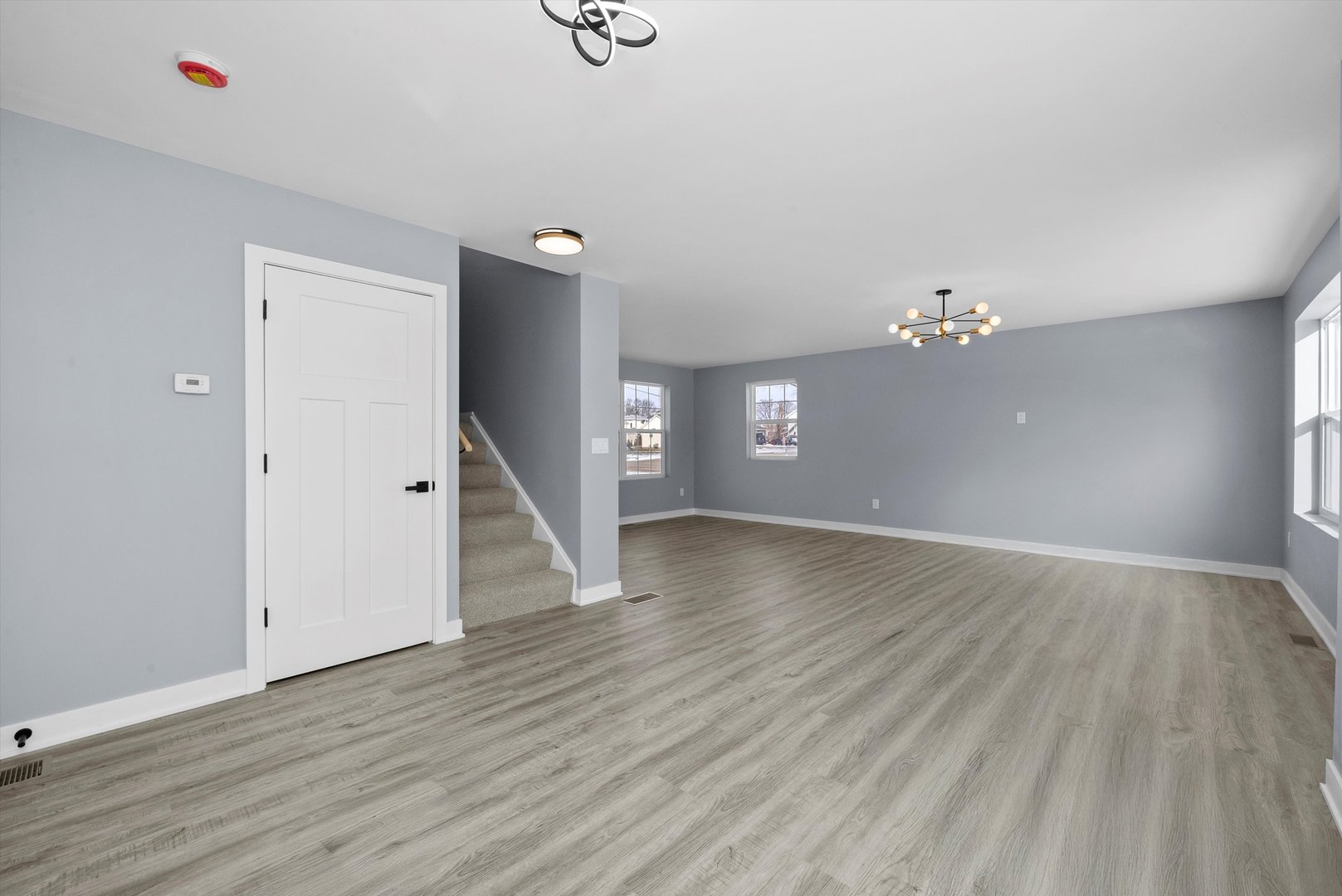 106 West Thompson Street Harvard, IL 60033 - Photo 17 of 46 wooden floor in an empty room with a window