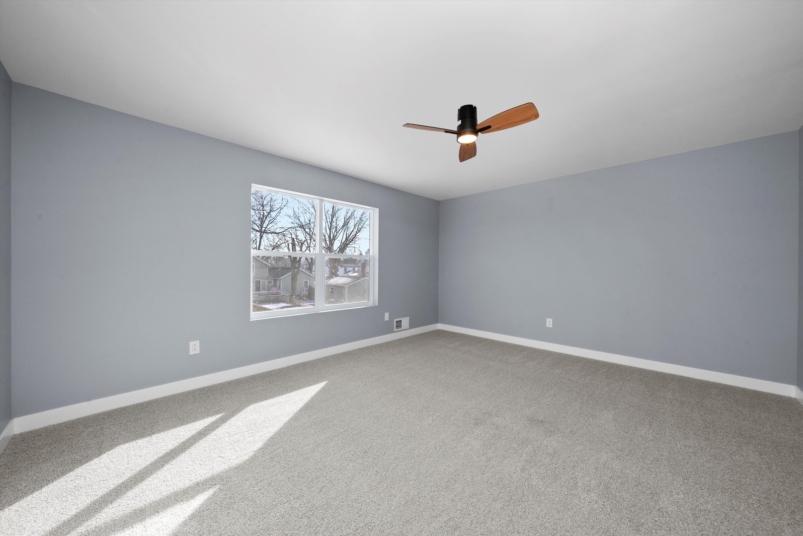 106 West Thompson Street Harvard, IL 60033 - Photo 20 of 46 a view of room with window and ceiling fan