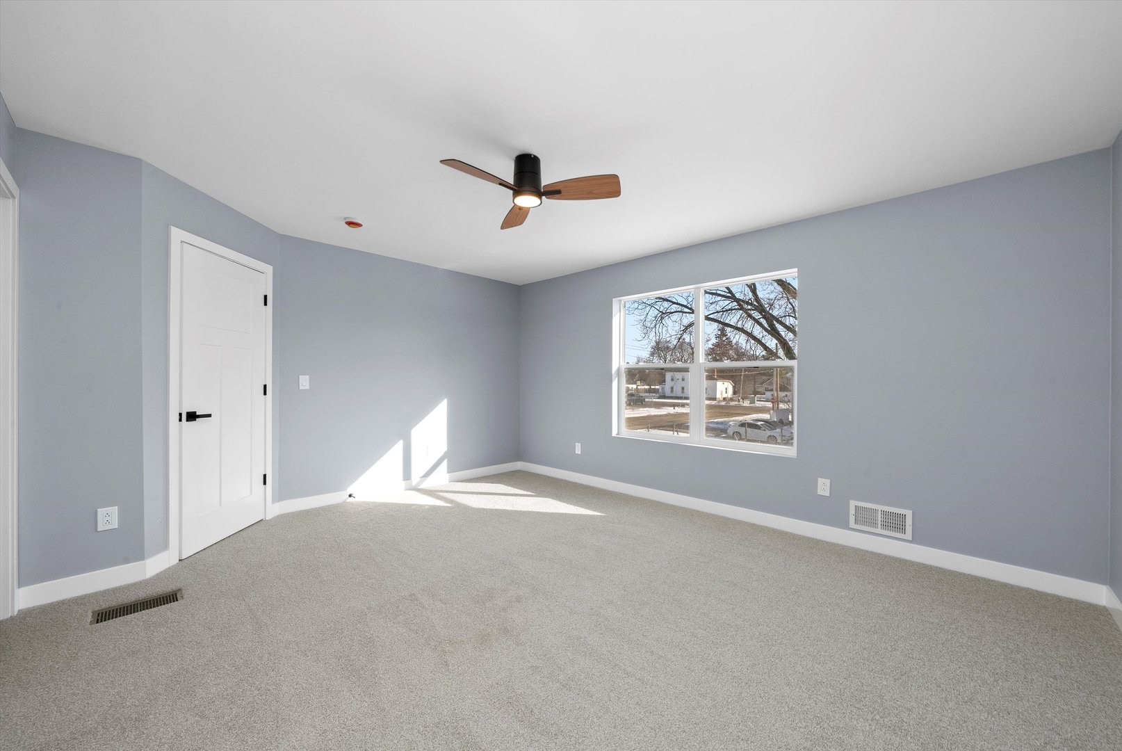 106 West Thompson Street Harvard, IL 60033 - Photo 22 of 46 a view of an empty room with a window