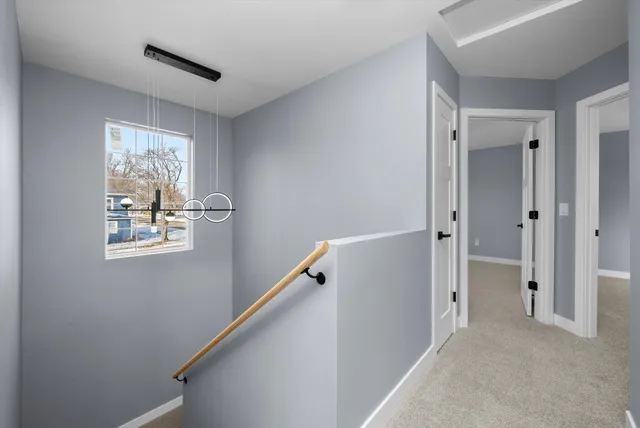 a view of room with window and hallway