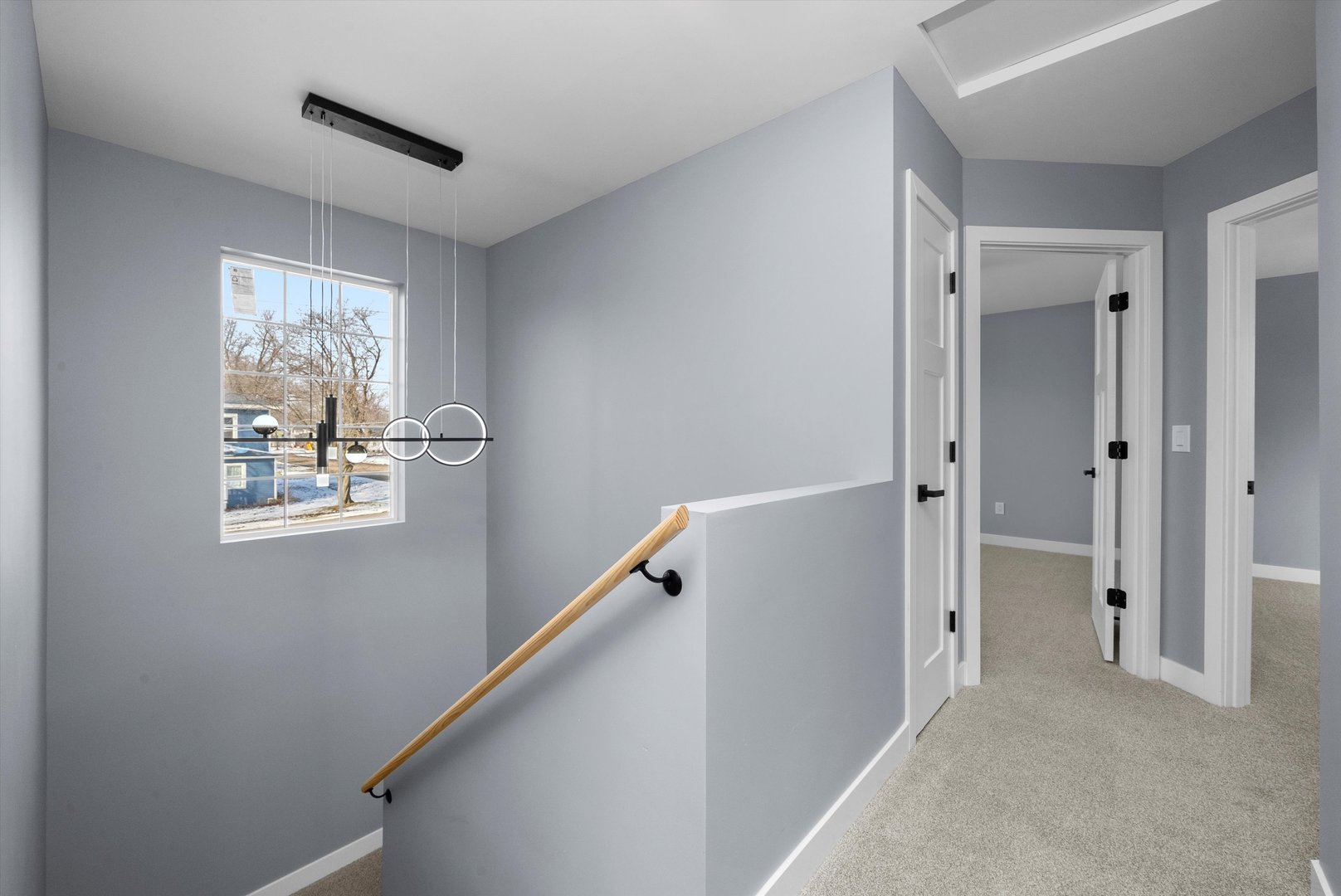 106 West Thompson Street Harvard, IL 60033 - Photo 26 of 46 a view of room with window and hallway