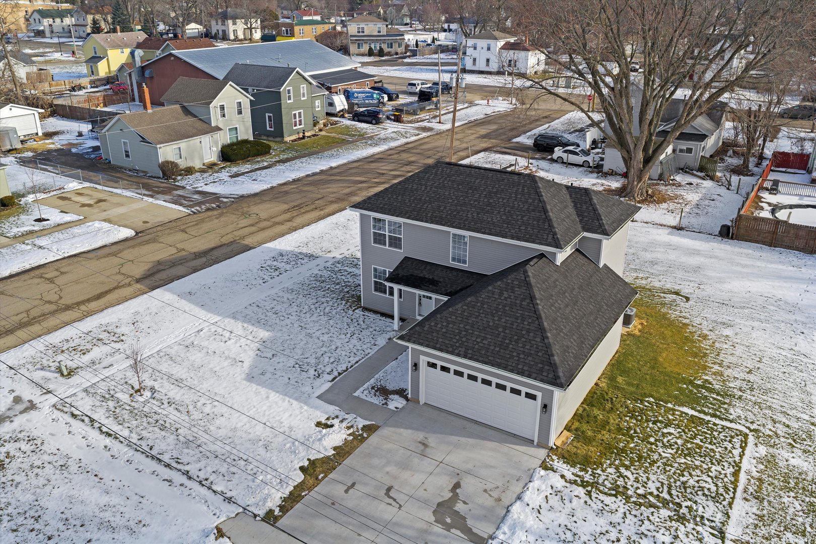 106 West Thompson Street Harvard, IL 60033 - Photo 29 of 46 an aerial view of a house with a yard