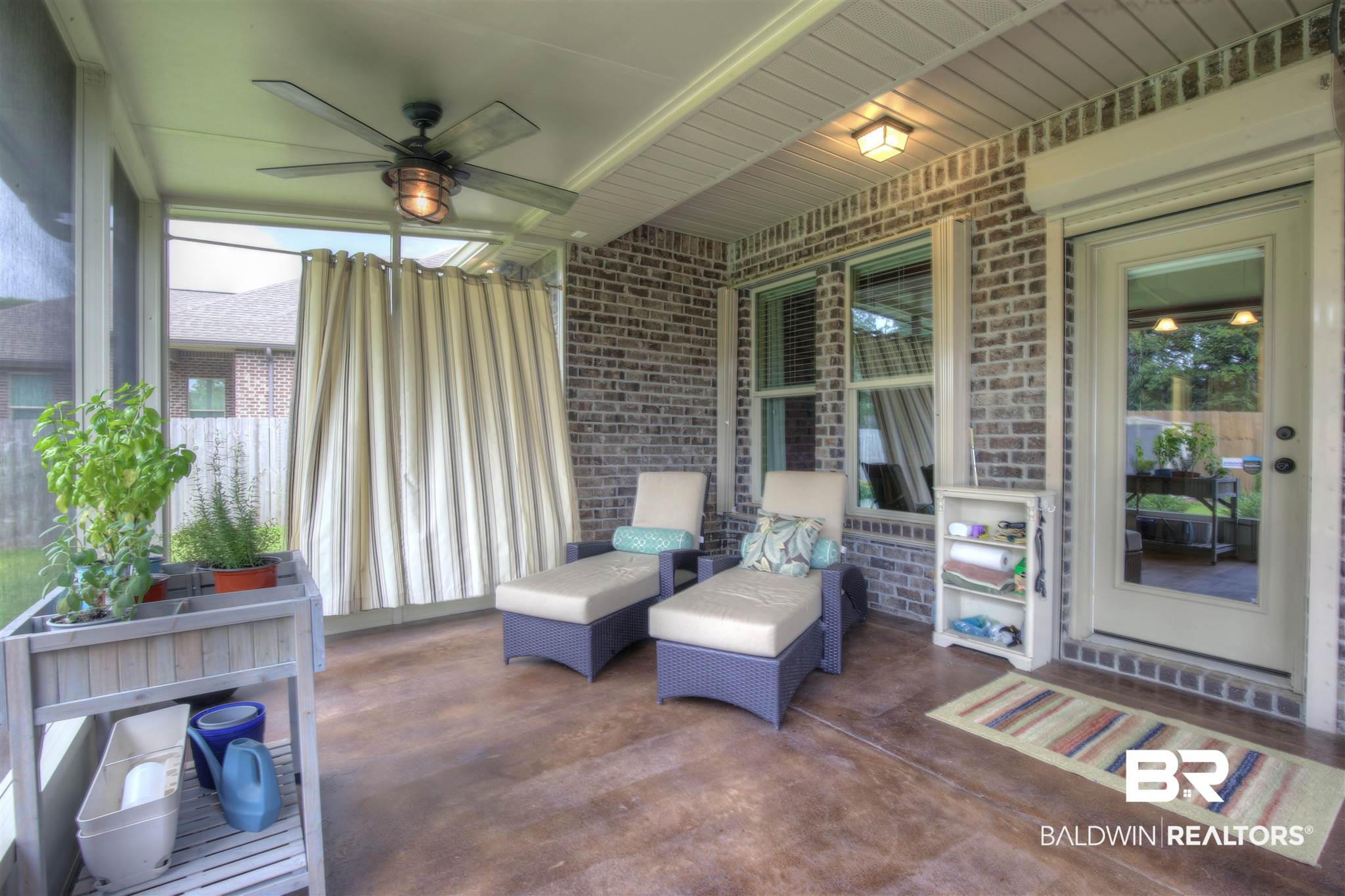 684 Turquoise Drive Fairhope, AL 36532 - Photo 19 of 25 Screened in back porch