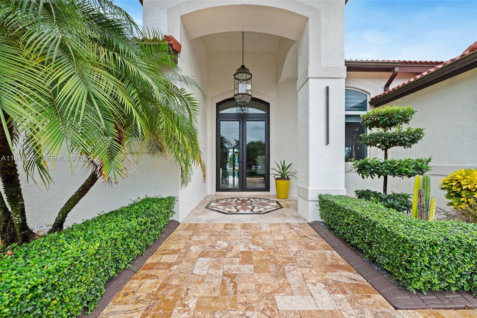 17490 Southwest 70th Place Southwest Ranches, FL 33331 - Photo 12 of 64 a front view of a house with a yard