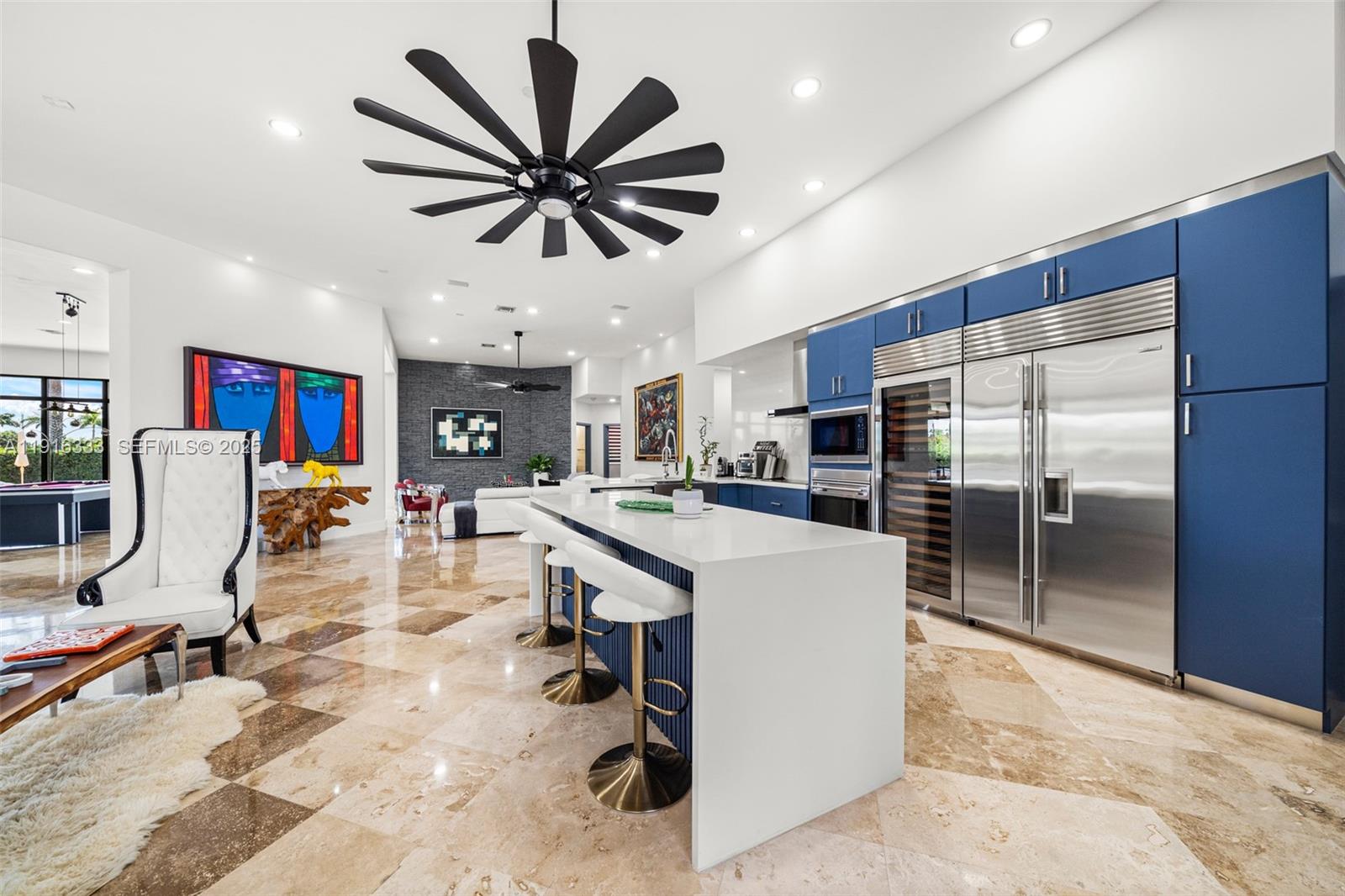 17490 Southwest 70th Place Southwest Ranches, FL 33331 - Photo 13 of 64 a living room with stainless steel appliances kitchen island furniture and a view of kitchen