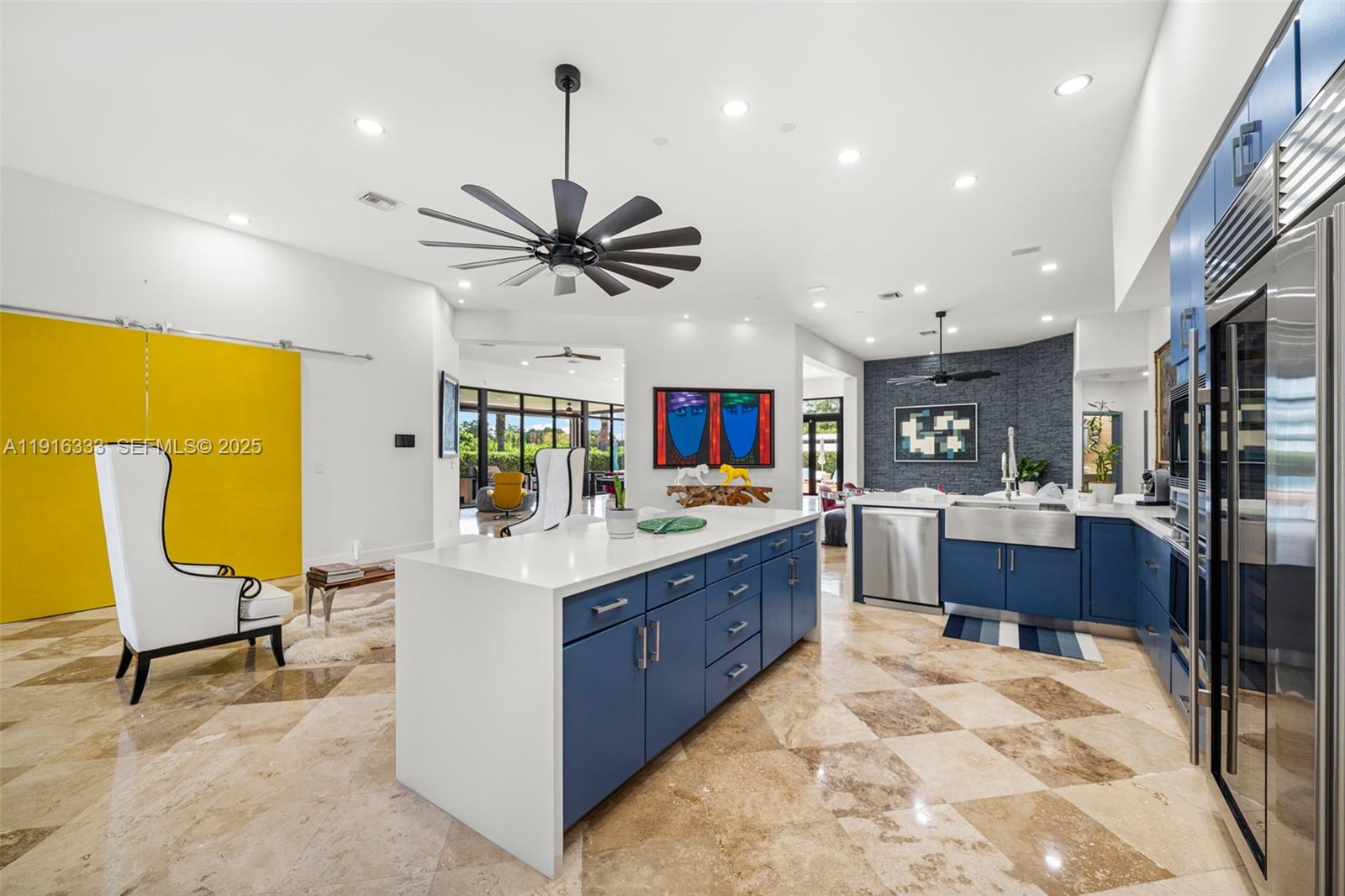 17490 Southwest 70th Place Southwest Ranches, FL 33331 - Photo 17 of 64 a large kitchen with stainless steel appliances kitchen island granite countertop a sink and cabinets