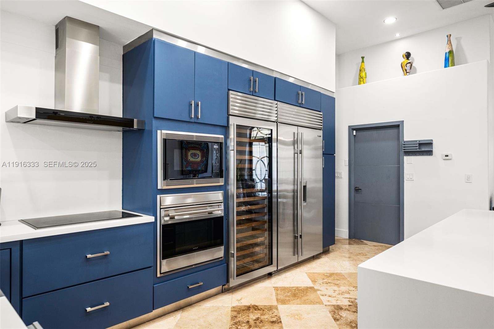 17490 Southwest 70th Place Southwest Ranches, FL 33331 - Photo 19 of 64 a kitchen with stainless steel appliances a refrigerator and a stove