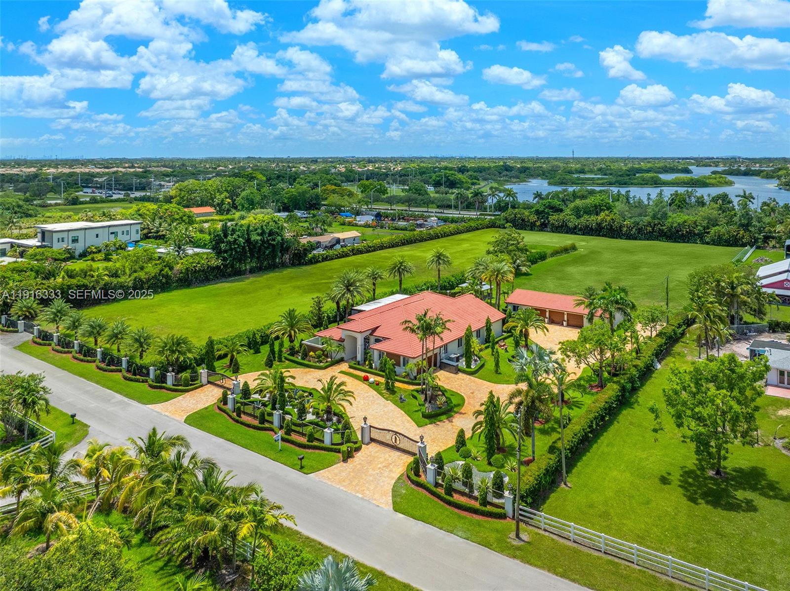 17490 Southwest 70th Place Southwest Ranches, FL 33331 - Photo 2 of 64 a view of a city and mountains in the background