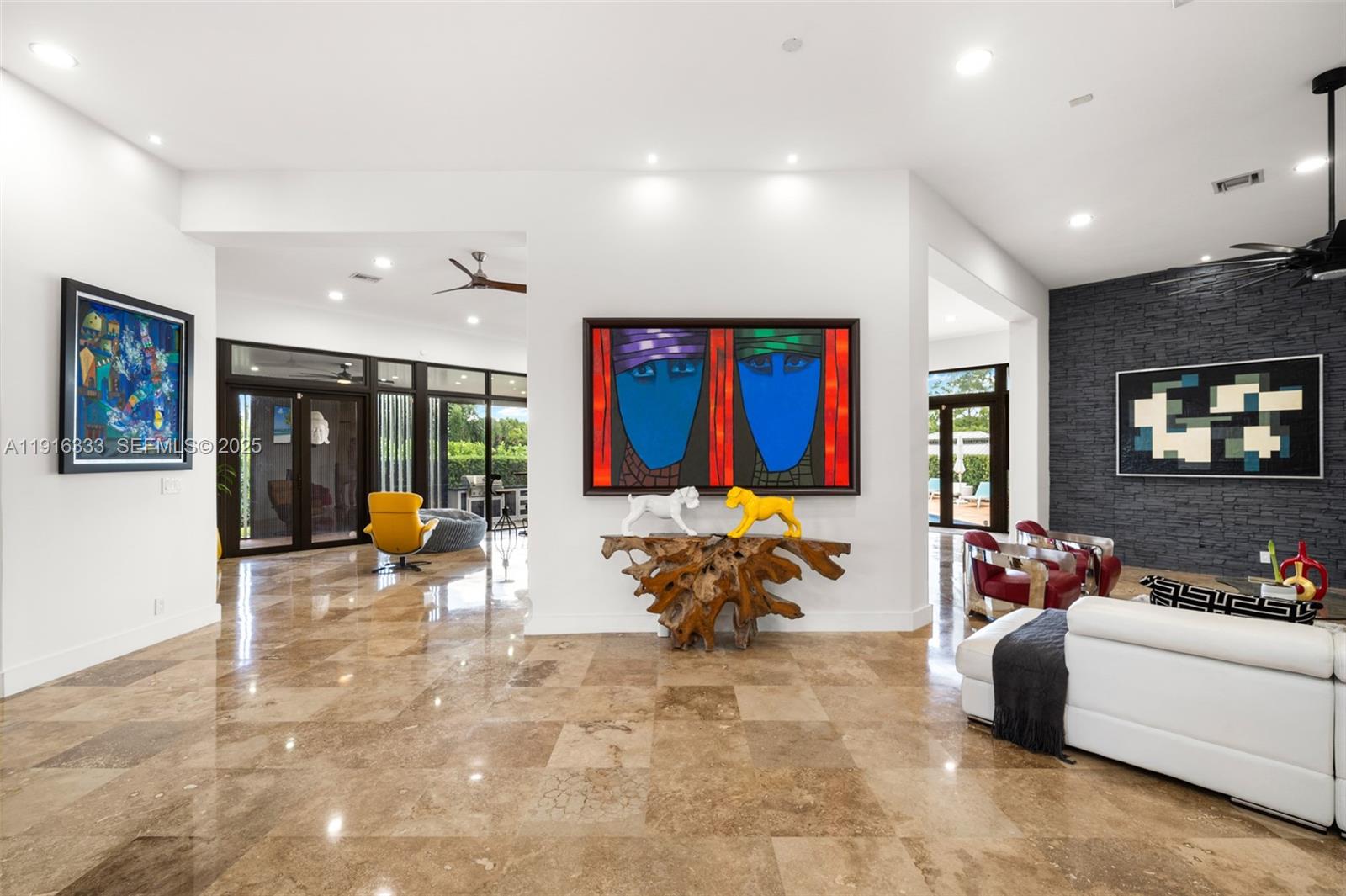 17490 Southwest 70th Place Southwest Ranches, FL 33331 - Photo 21 of 64 a living room with furniture and a flat screen tv