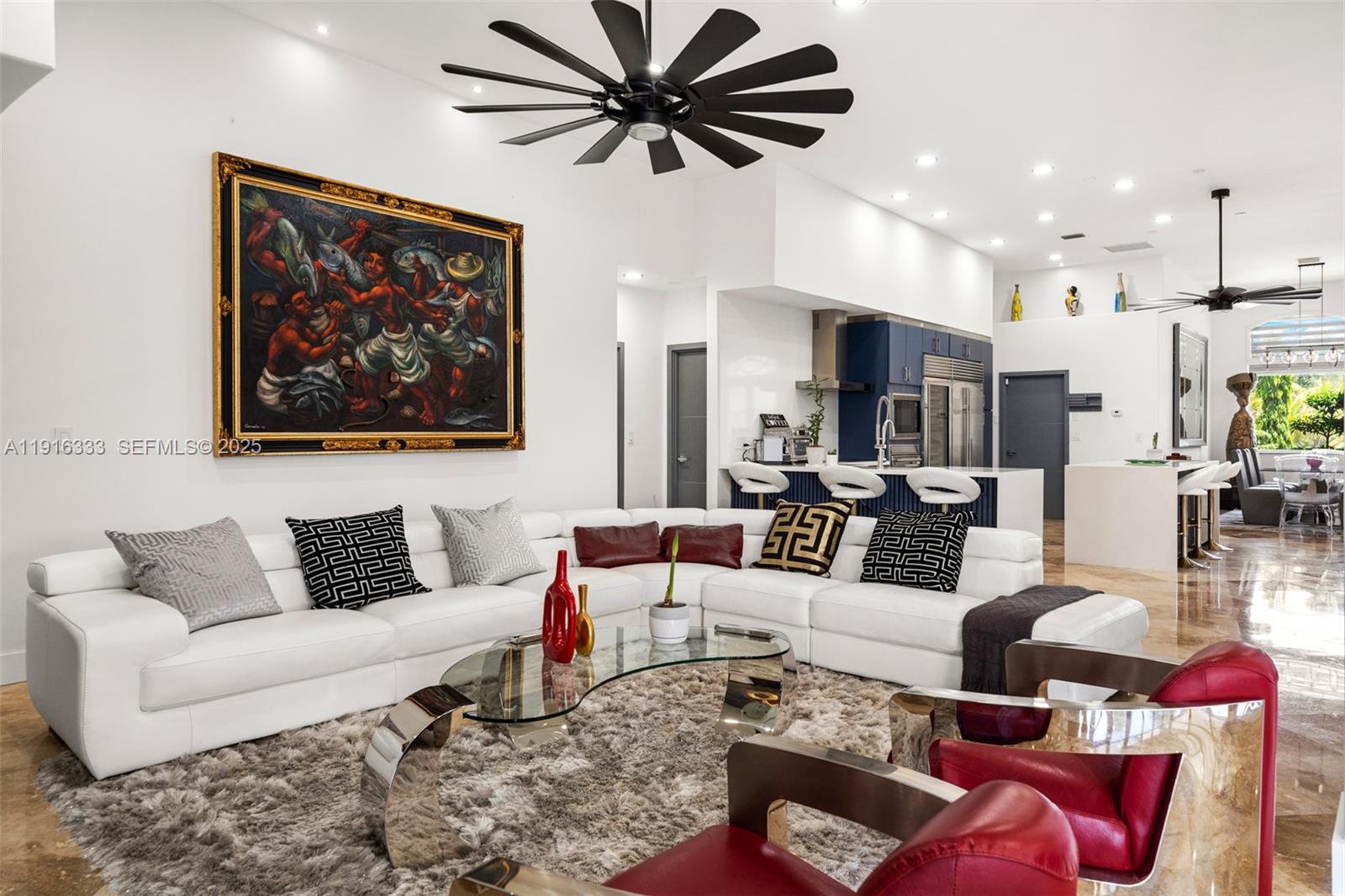 17490 Southwest 70th Place Southwest Ranches, FL 33331 - Photo 23 of 64 a living room with furniture kitchen view and a chandelier