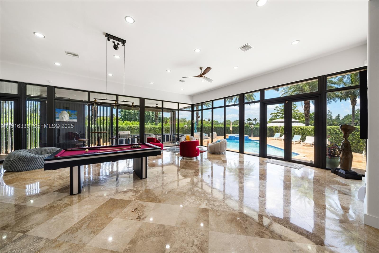 17490 Southwest 70th Place Southwest Ranches, FL 33331 - Photo 26 of 64 a very nice looking room with a large window and furniture