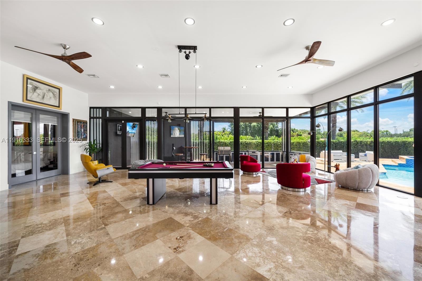 17490 Southwest 70th Place Southwest Ranches, FL 33331 - Photo 28 of 64 a view of a lobby with furniture and floor to ceiling window