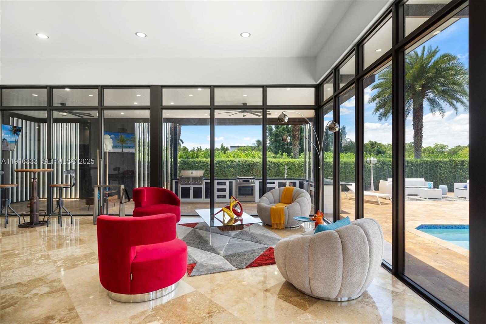 17490 Southwest 70th Place Southwest Ranches, FL 33331 - Photo 29 of 64 a living room with furniture and a large window