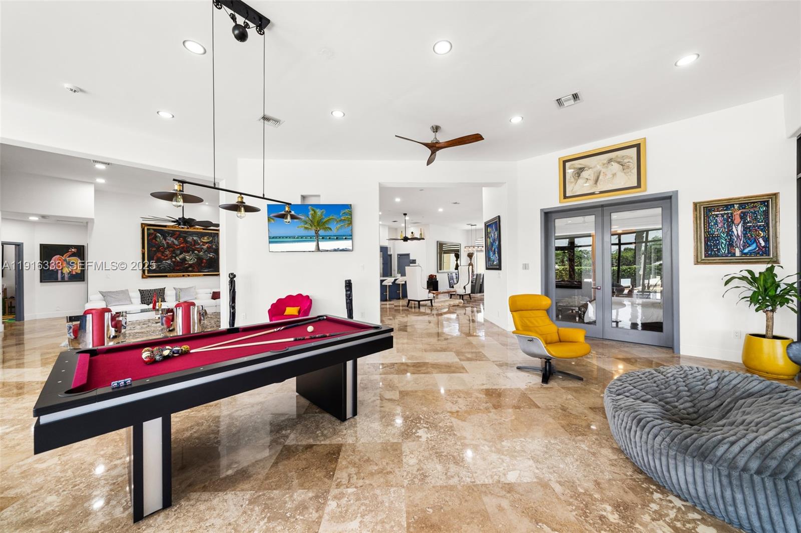 17490 Southwest 70th Place Southwest Ranches, FL 33331 - Photo 30 of 64 a living room with furniture pool table and flat screen tv