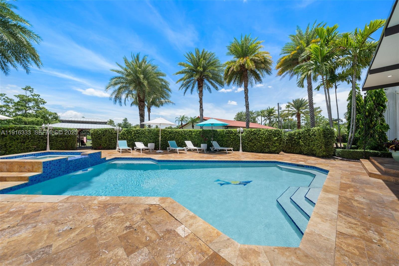 17490 Southwest 70th Place Southwest Ranches, FL 33331 - Photo 33 of 64 a view of swimming pool with a garden and outdoor seating