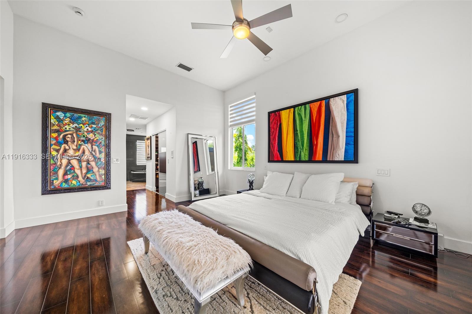 17490 Southwest 70th Place Southwest Ranches, FL 33331 - Photo 38 of 64 a bedroom with a bed and a large mirror on the dresser