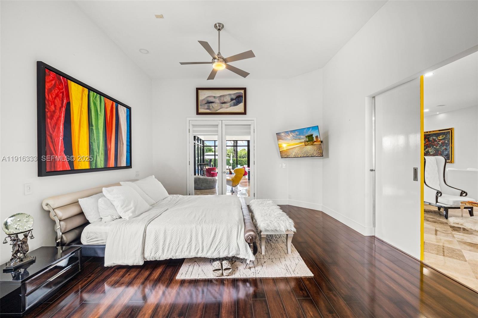 17490 Southwest 70th Place Southwest Ranches, FL 33331 - Photo 40 of 64 a bedroom with a bed and wooden floor