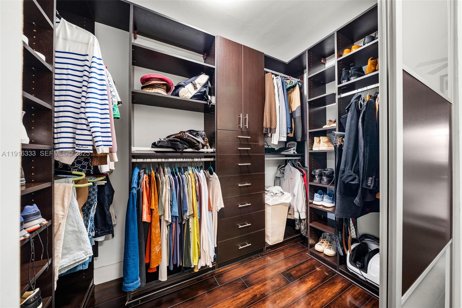 17490 Southwest 70th Place Southwest Ranches, FL 33331 - Photo 42 of 64 a view of walk in closet with clothes and shoes