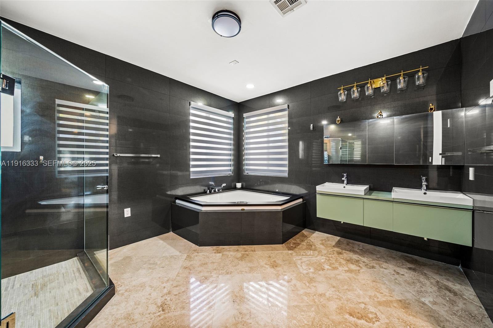 17490 Southwest 70th Place Southwest Ranches, FL 33331 - Photo 44 of 64 a large bathroom with a large tub and sink