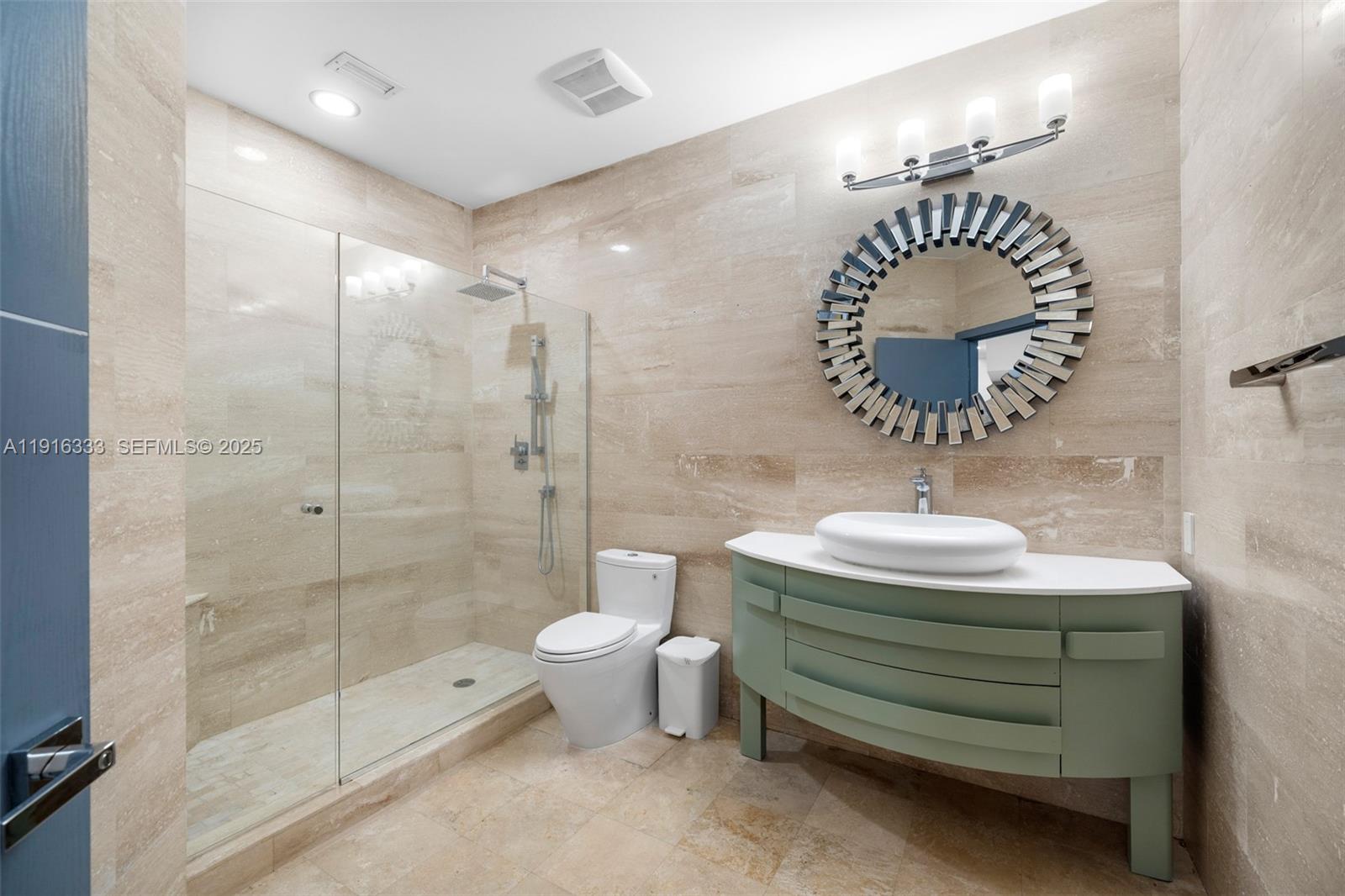 17490 Southwest 70th Place Southwest Ranches, FL 33331 - Photo 48 of 64 a bathroom with a sink a toilet and shower