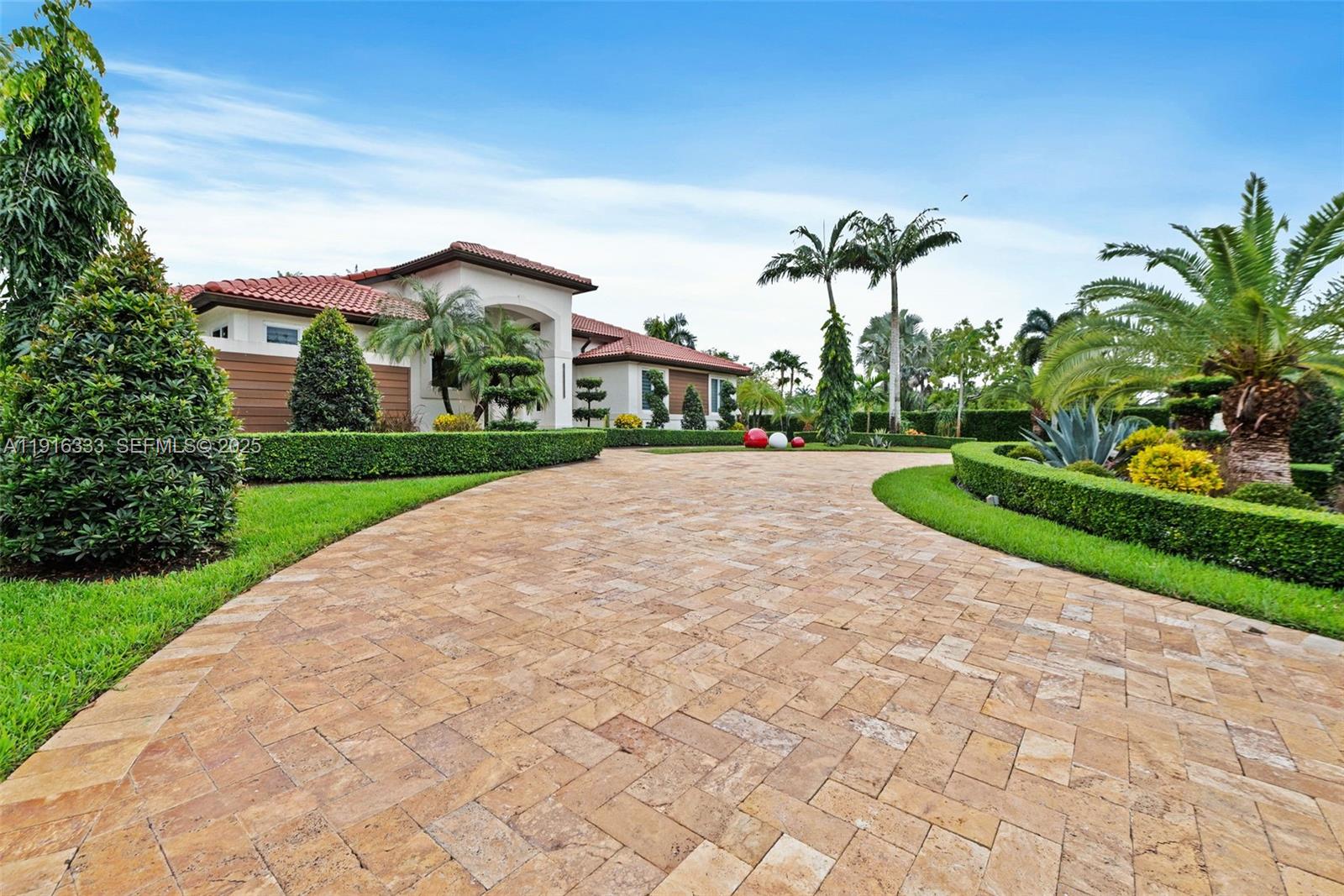 17490 Southwest 70th Place Southwest Ranches, FL 33331 - Photo 5 of 64 a view of a house with a yard and potted plants