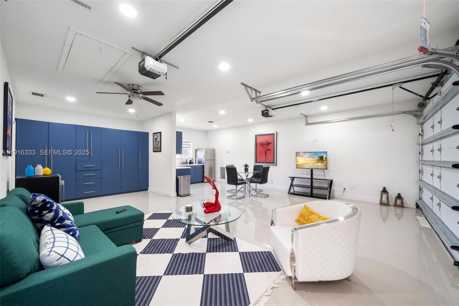 17490 Southwest 70th Place Southwest Ranches, FL 33331 - Photo 52 of 64 a room with furniture a clock and a view of living room