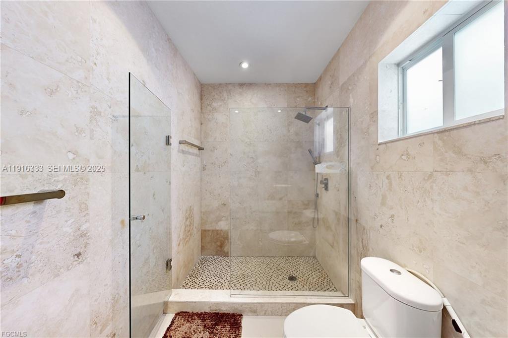 17490 Southwest 70th Place Southwest Ranches, FL 33331 - Photo 58 of 64 a bathroom with a shower and toilet