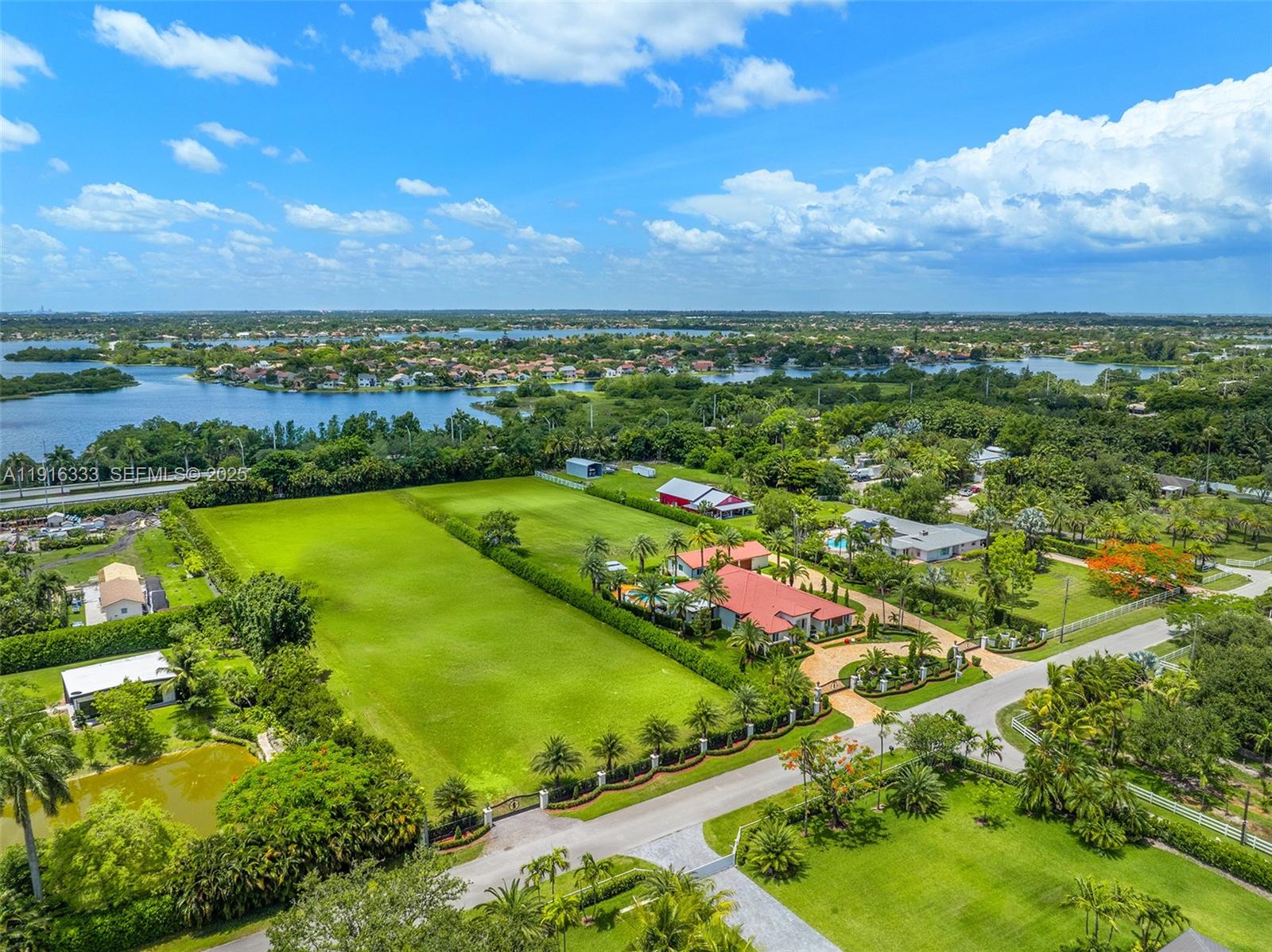 17490 Southwest 70th Place Southwest Ranches, FL 33331 - Photo 63 of 64 an aerial view of residential houses with outdoor space and garden