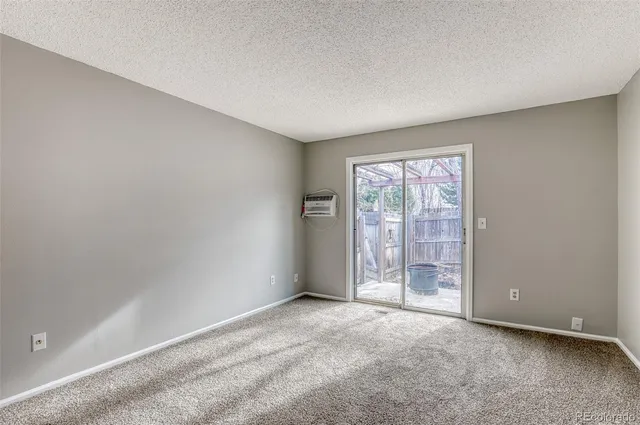 an empty room with glass door