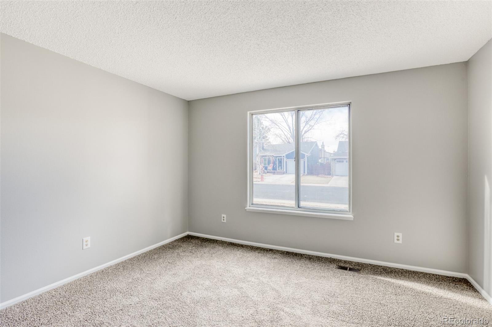 1912 Rice Street Longmont, CO 80501 - Photo 19 of 29 an empty room with a window