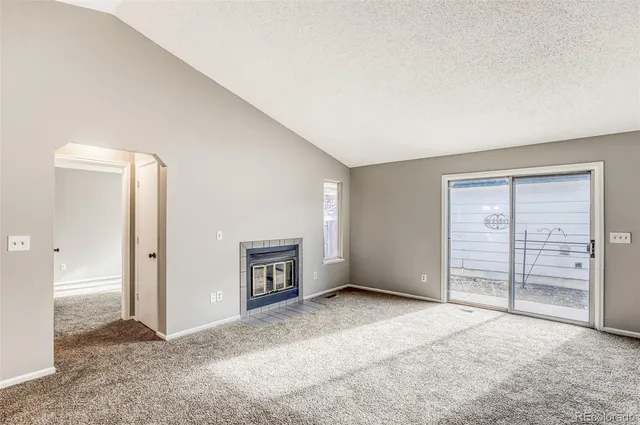 an empty room with a empty space and natural light