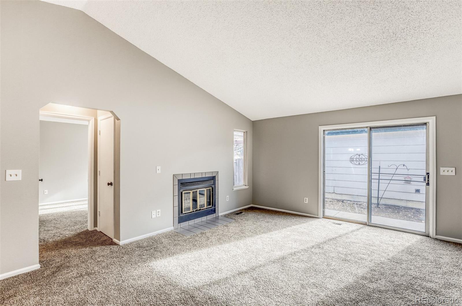 1912 Rice Street Longmont, CO 80501 - Photo 4 of 29 an empty room with a empty space and natural light